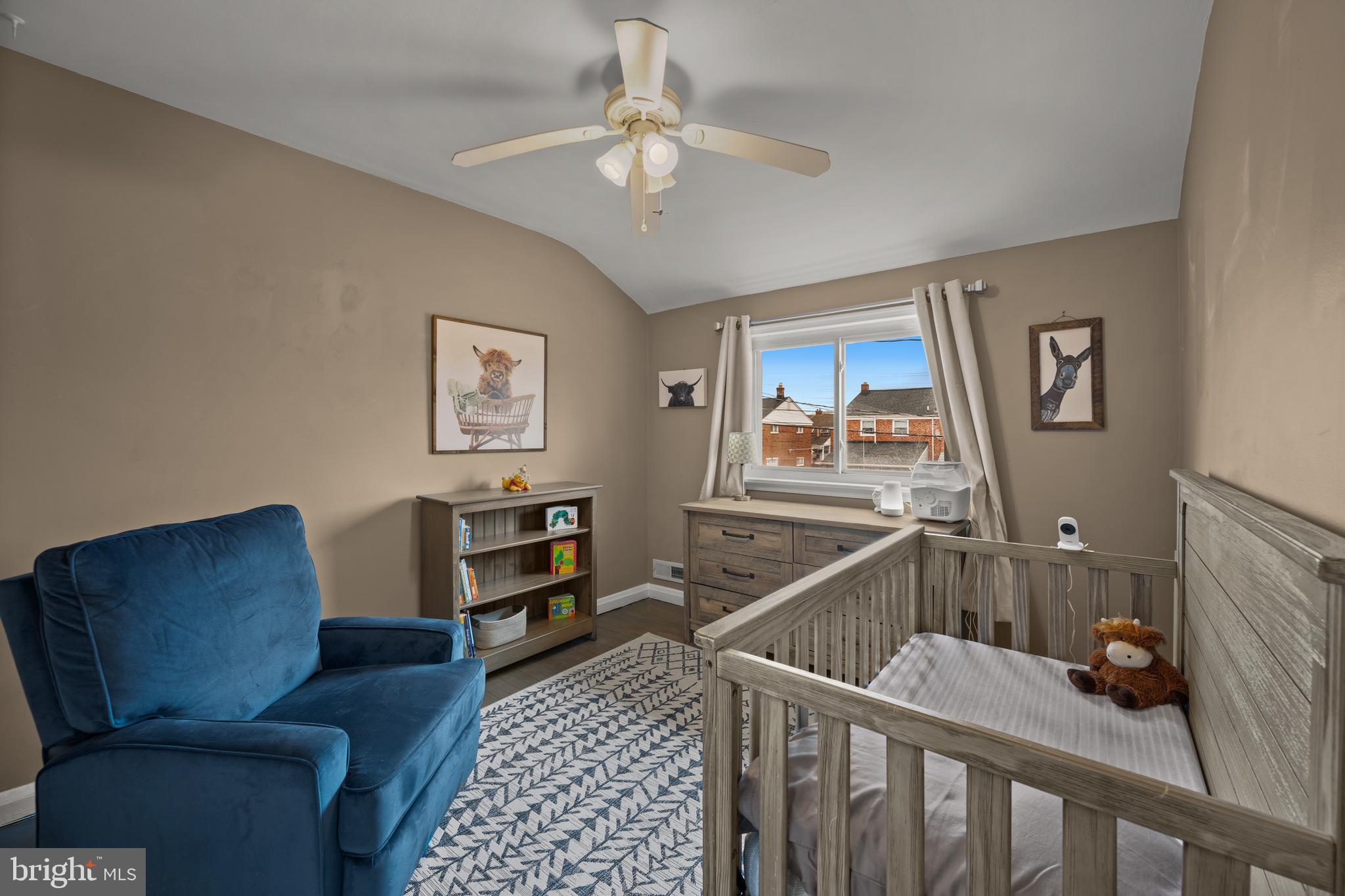 1955 Holborn Road Baltimore, MD 21222 - Photo 19 of 36 a living room with furniture and paintings on the wall
