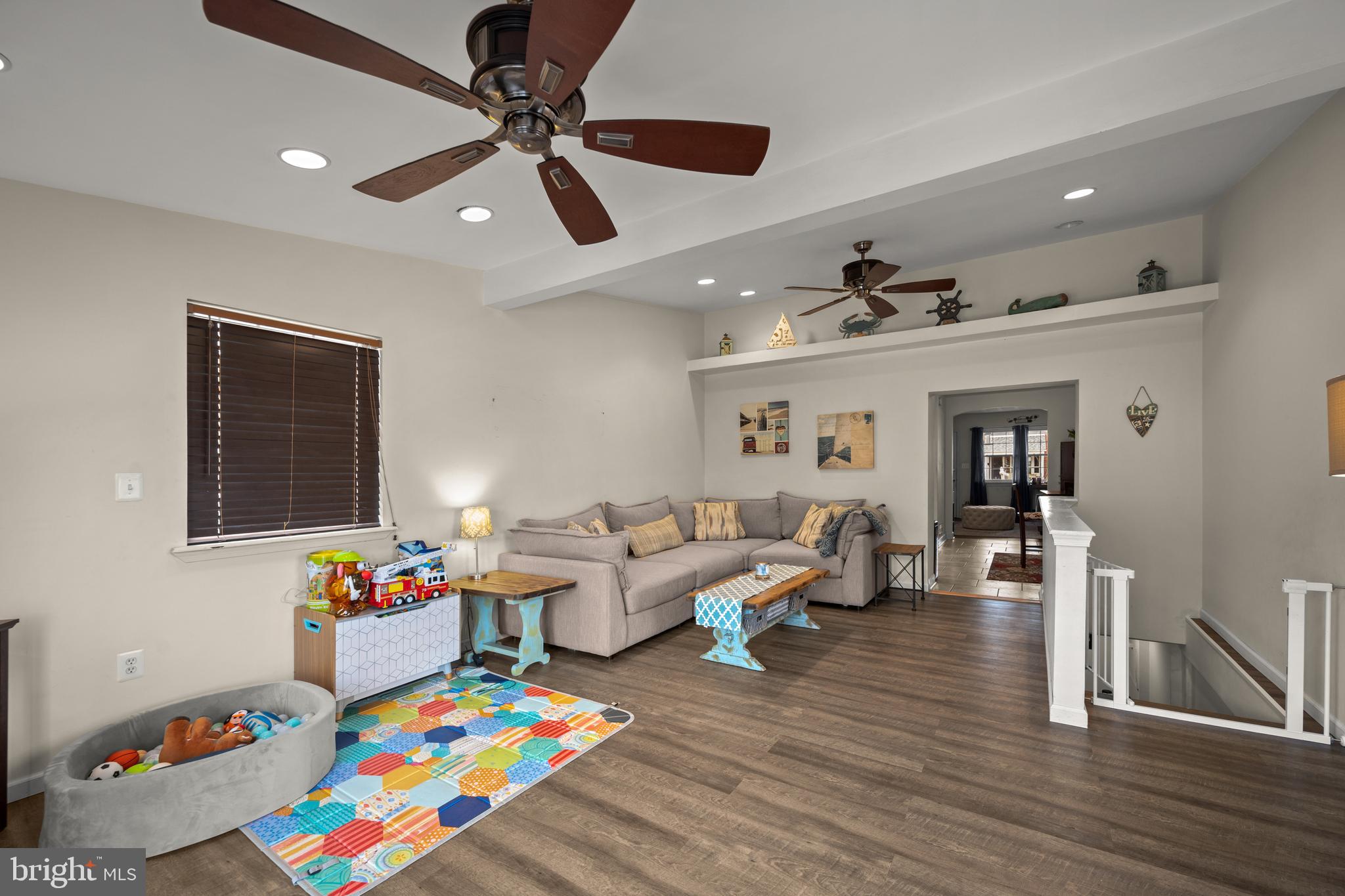 1955 Holborn Road Baltimore, MD 21222 - Photo 22 of 36 a living room with furniture and a dining table with wooden floor