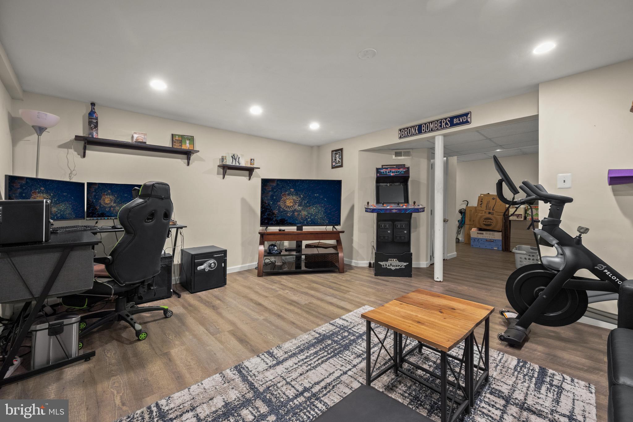 1955 Holborn Road Baltimore, MD 21222 - Photo 25 of 36 a room with furniture a flat screen tv and gym equipment