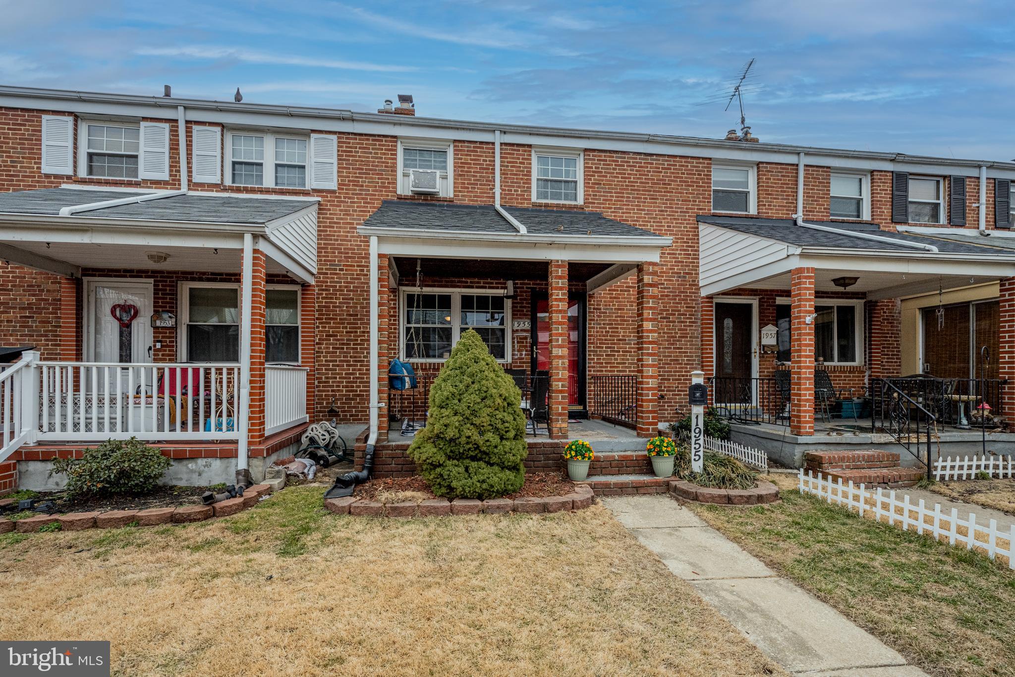 1955 Holborn Road Baltimore, MD 21222 - Photo 32 of 36 front view of a brick house with a yard
