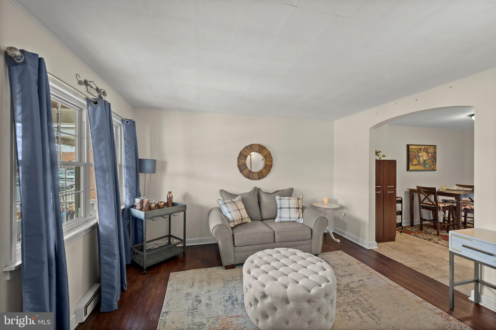 1955 Holborn Road Baltimore, MD 21222 - Photo 5 of 36 a living room with furniture a fireplace and a table