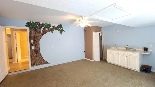 a view of a storage & utility room with a sink