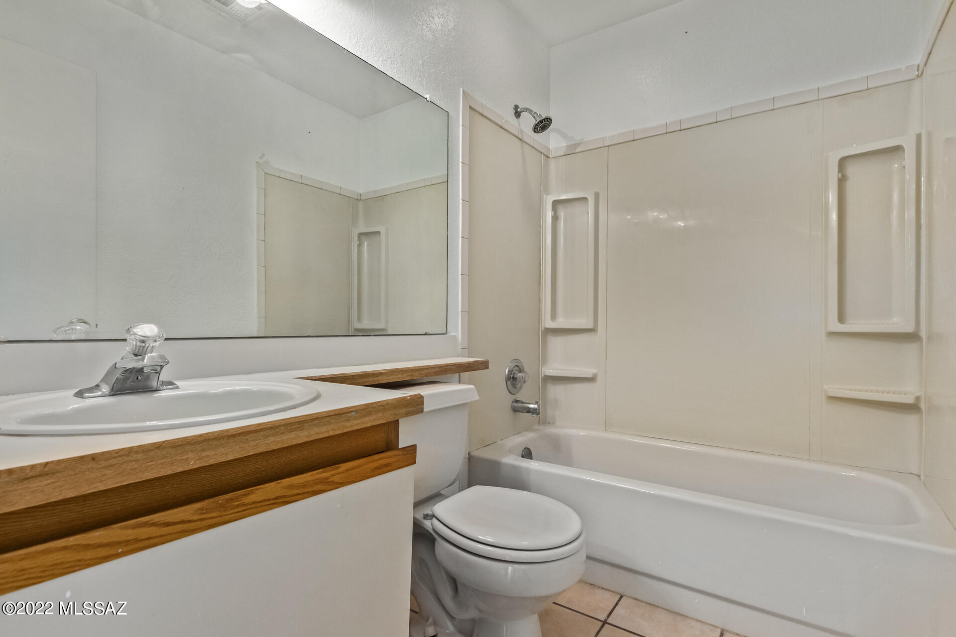 4697 West Weathervane Street Tucson, AZ 85741 - Photo 21 of 25 a bathroom with a sink toilet vanity and shower