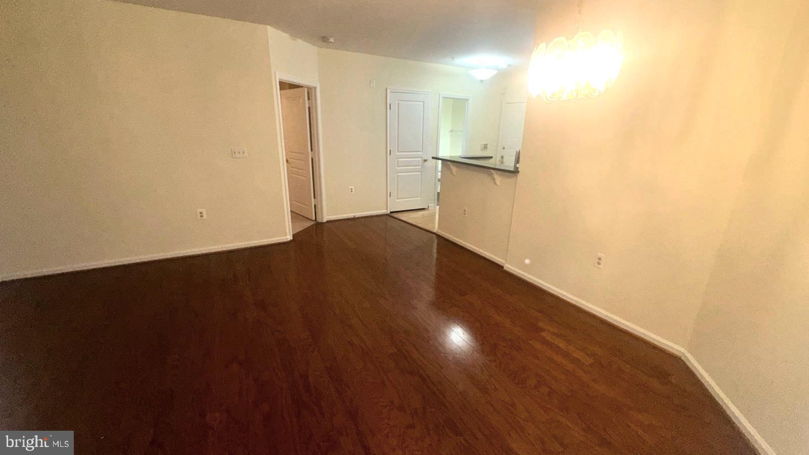 12919 Alton Square, Unit 203 Herndon, VA 20170 - Photo 15 of 22 a view of empty room with wooden floor