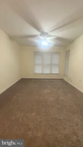 a view of a small space with wooden floor