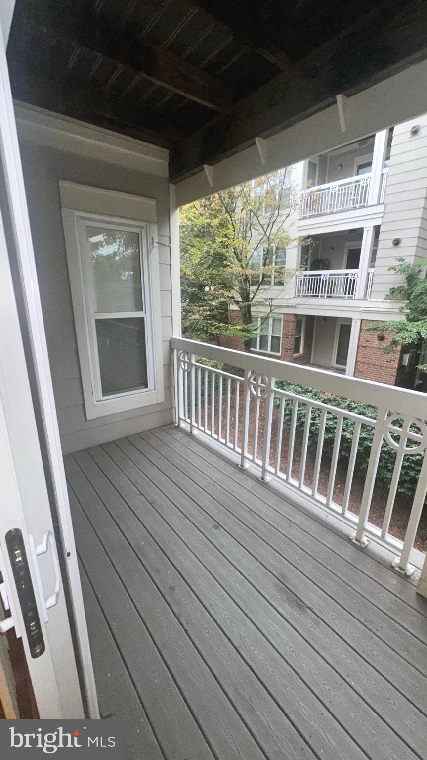 12919 Alton Square, Unit 203 Herndon, VA 20170 - Photo 20 of 22 a view of a balcony with wooden floor