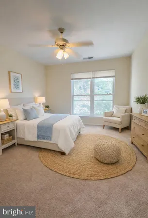 a bedroom with bed and a chandelier