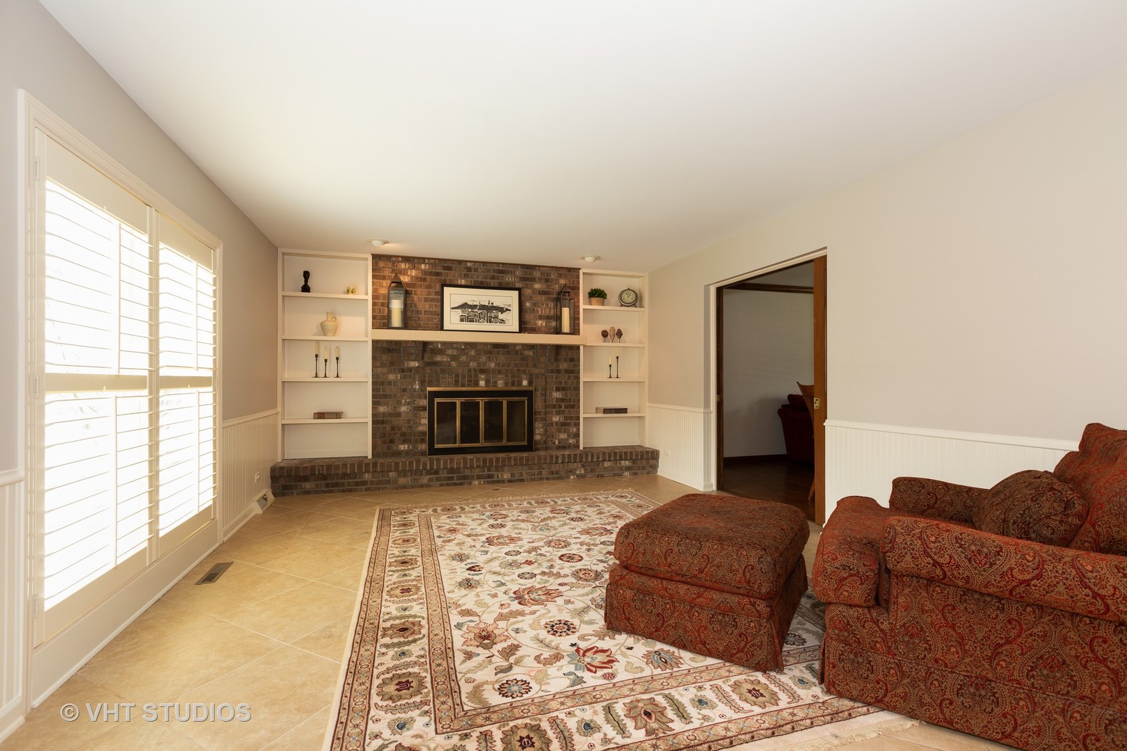 620 Buttonwood Circle Naperville, IL 60540 - Photo 12 of 29 a living room with furniture and a fireplace