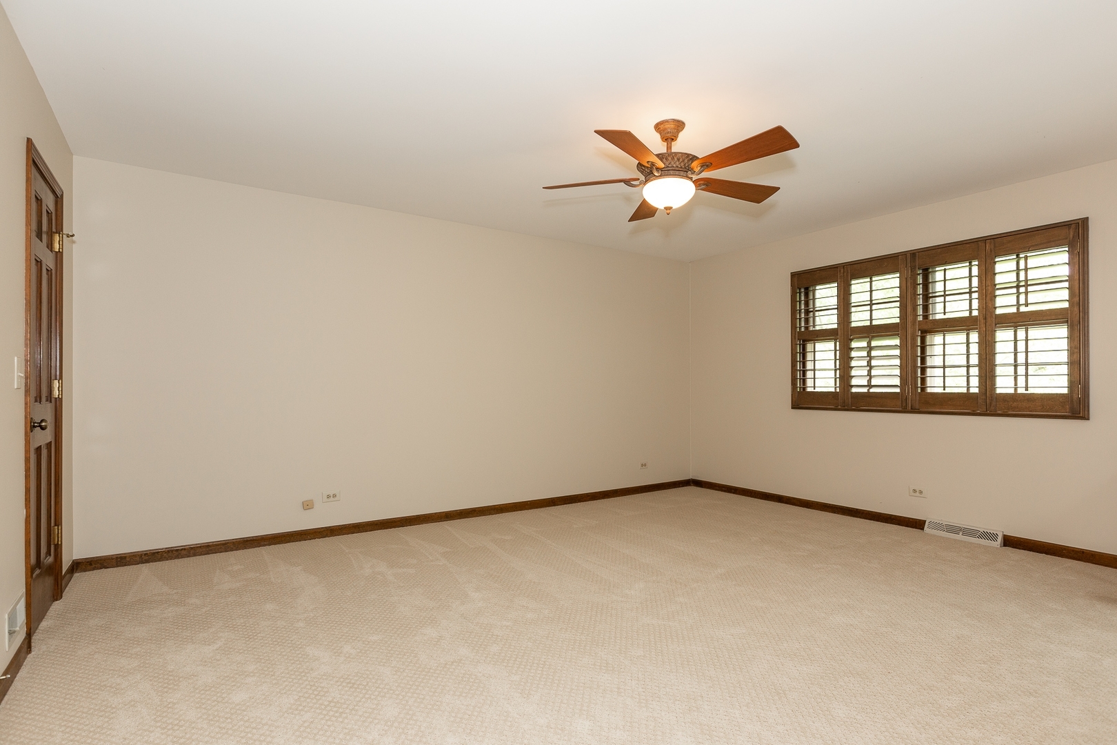 620 Buttonwood Circle Naperville, IL 60540 - Photo 15 of 29 an empty room with windows and fan