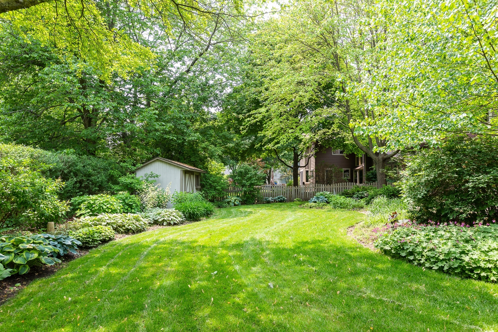 620 Buttonwood Circle Naperville, IL 60540 - Photo 27 of 29 a view of a backyard with large trees
