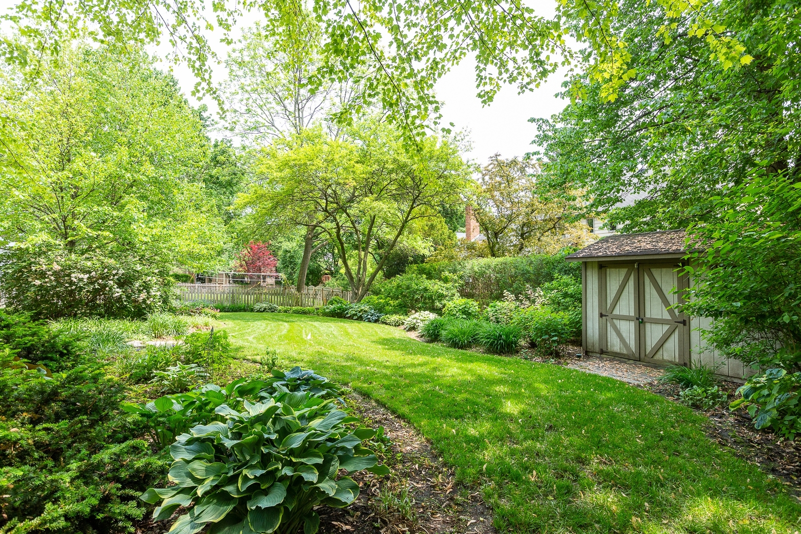 620 Buttonwood Circle Naperville, IL 60540 - Photo 28 of 29 a view of backyard with table and chairs and a large trees