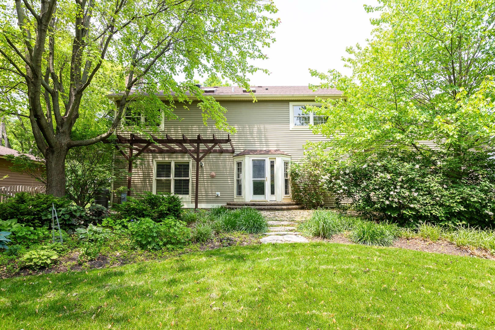 620 Buttonwood Circle Naperville, IL 60540 - Photo 29 of 29 a front view of a house with a yard