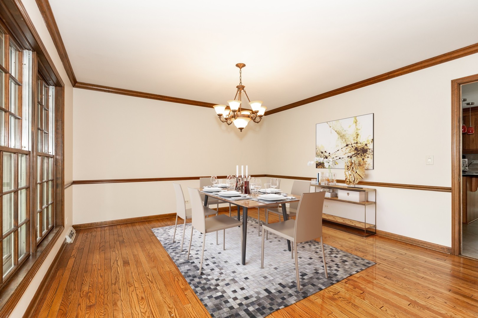 620 Buttonwood Circle Naperville, IL 60540 - Photo 10 of 29 a living room with stainless steel appliances furniture a rug and a chandelier
