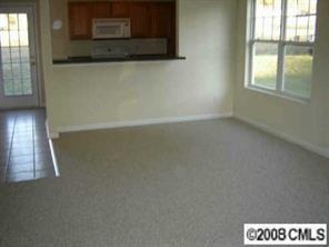 816 Raindrops Road Gastonia, NC 28054 - Photo 2 of 8 a view of an empty room and window