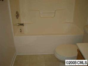 816 Raindrops Road Gastonia, NC 28054 - Photo 5 of 8 a bathroom with a shower and toilet