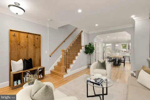 a large kitchen with cabinets and wooden floor