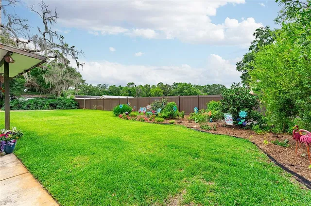 a view of a house with a yard porch and sitting area