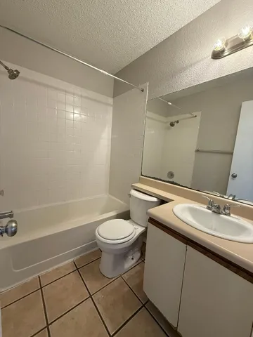 a bathroom with a sink a toilet and a bathtub