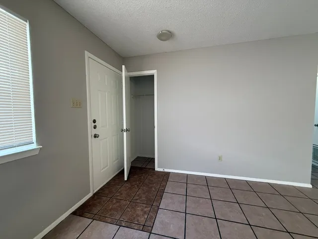 a kitchen with stainless steel appliances granite countertop a sink and a stove