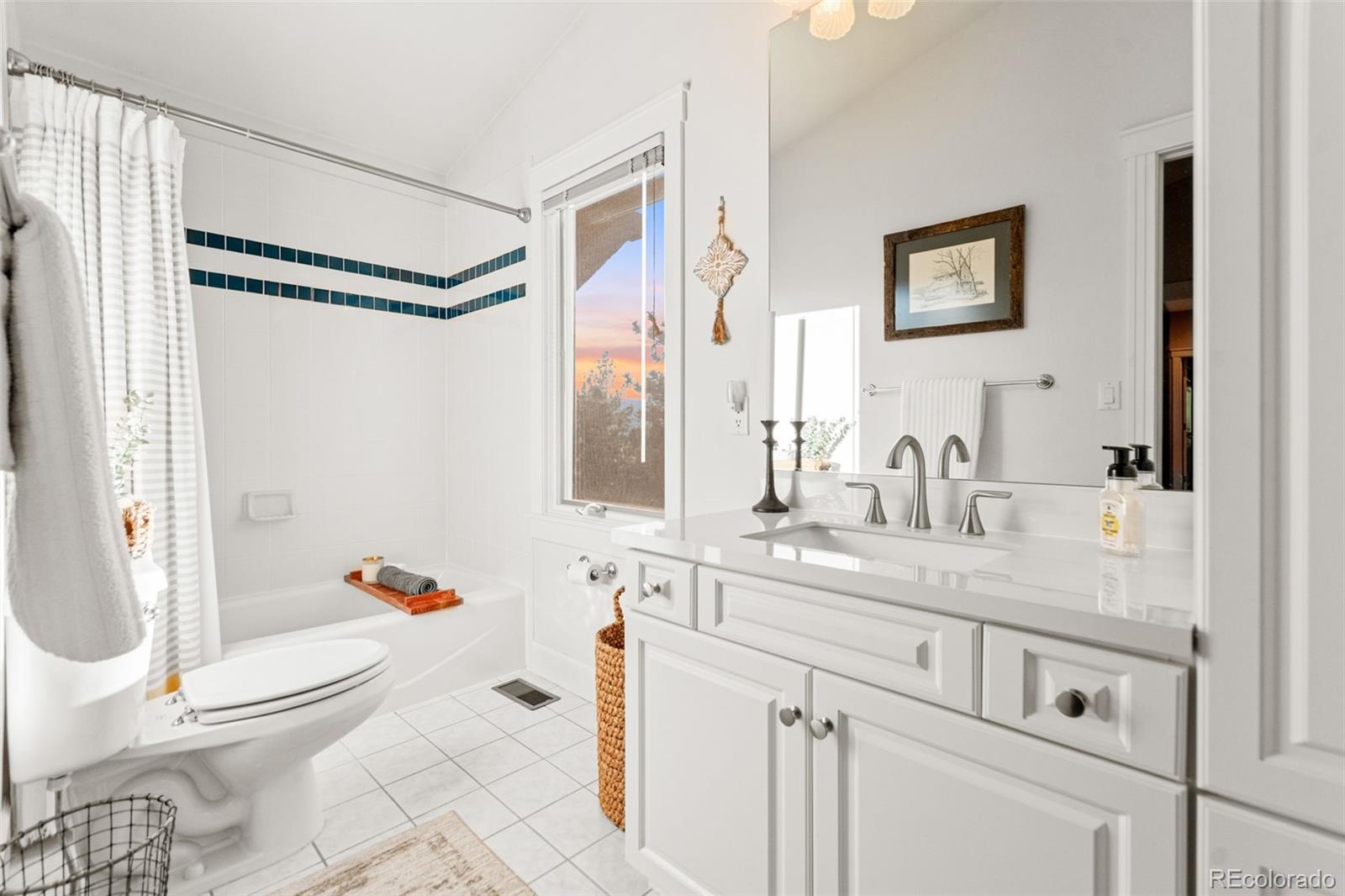 5090 South Perry Park Road Sedalia, CO 80135 - Photo 25 of 50 a bathroom with a granite countertop sink mirror vanity and toilet