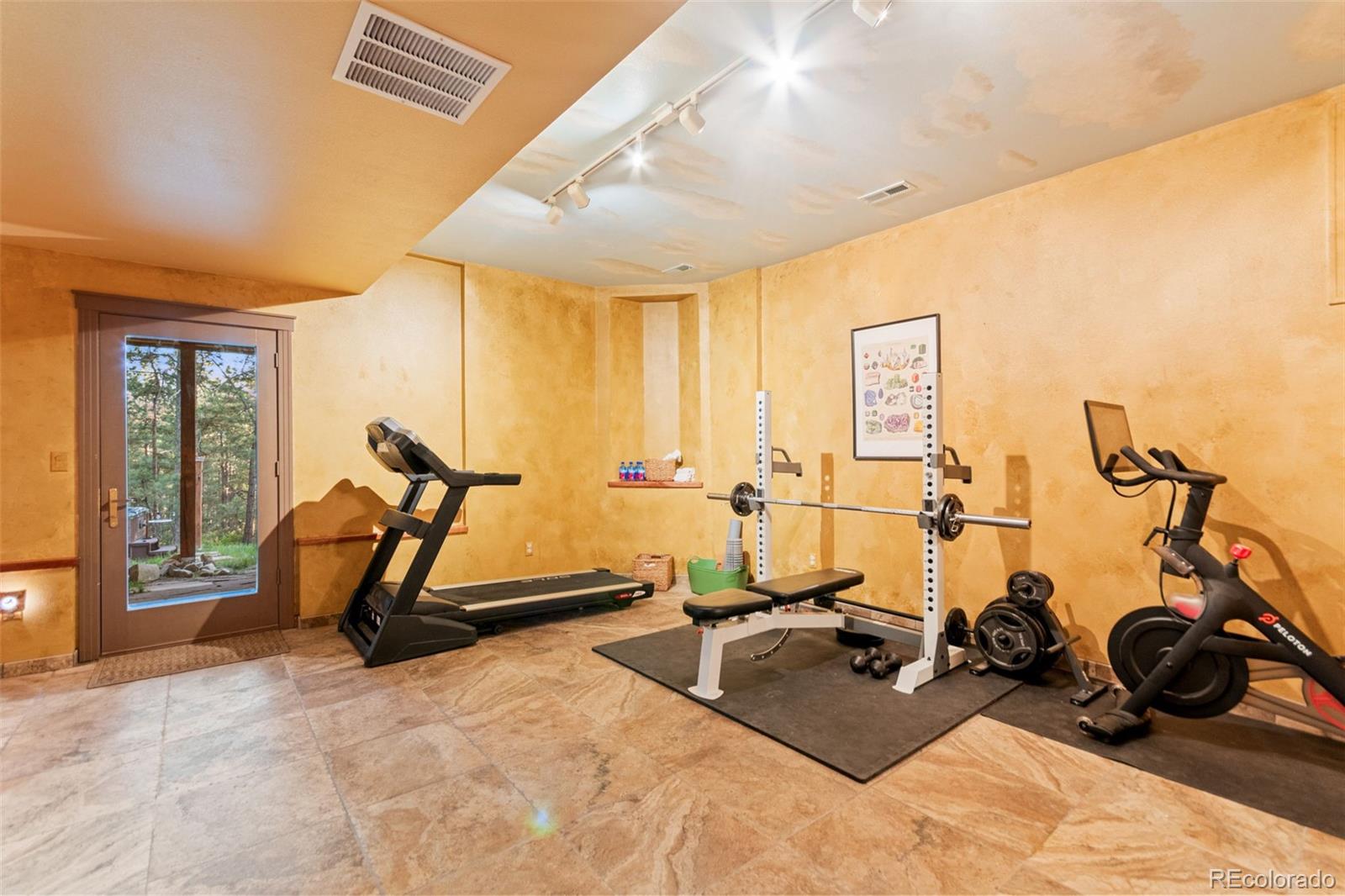 5090 South Perry Park Road Sedalia, CO 80135 - Photo 32 of 50 a view of a room with gym equipment