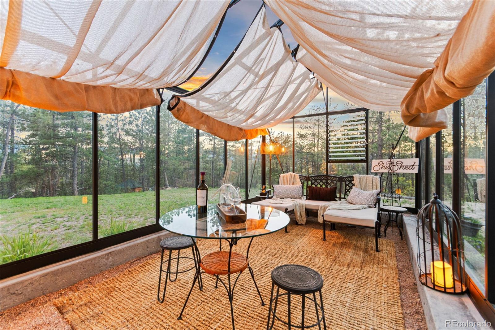 5090 South Perry Park Road Sedalia, CO 80135 - Photo 37 of 50 a outdoor space with patio couch and wooden floor