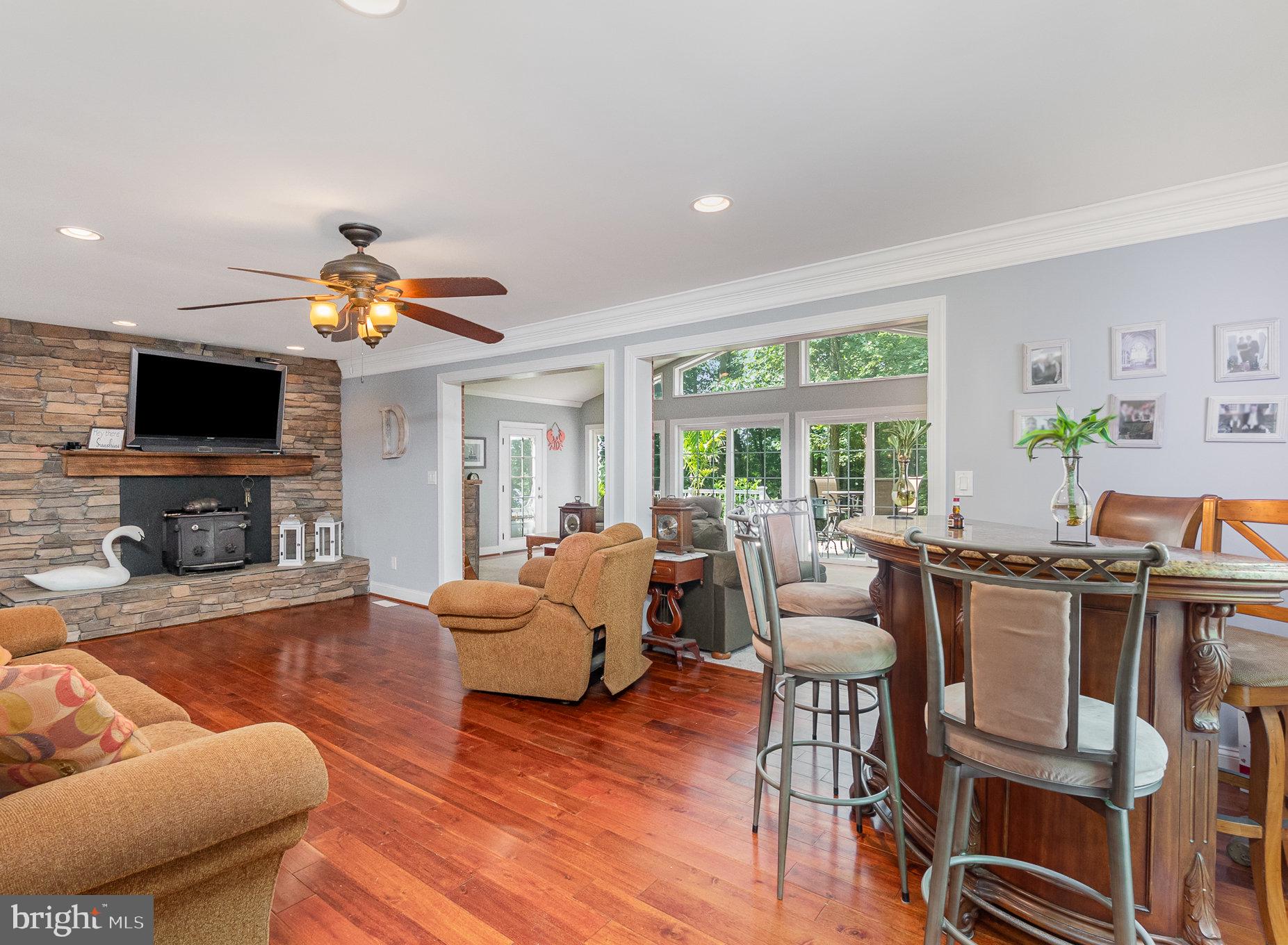 2414 Laurel Bush Road Abingdon, MD 21009 - Photo 12 of 68 a living room with furniture a flat screen tv and a fireplace