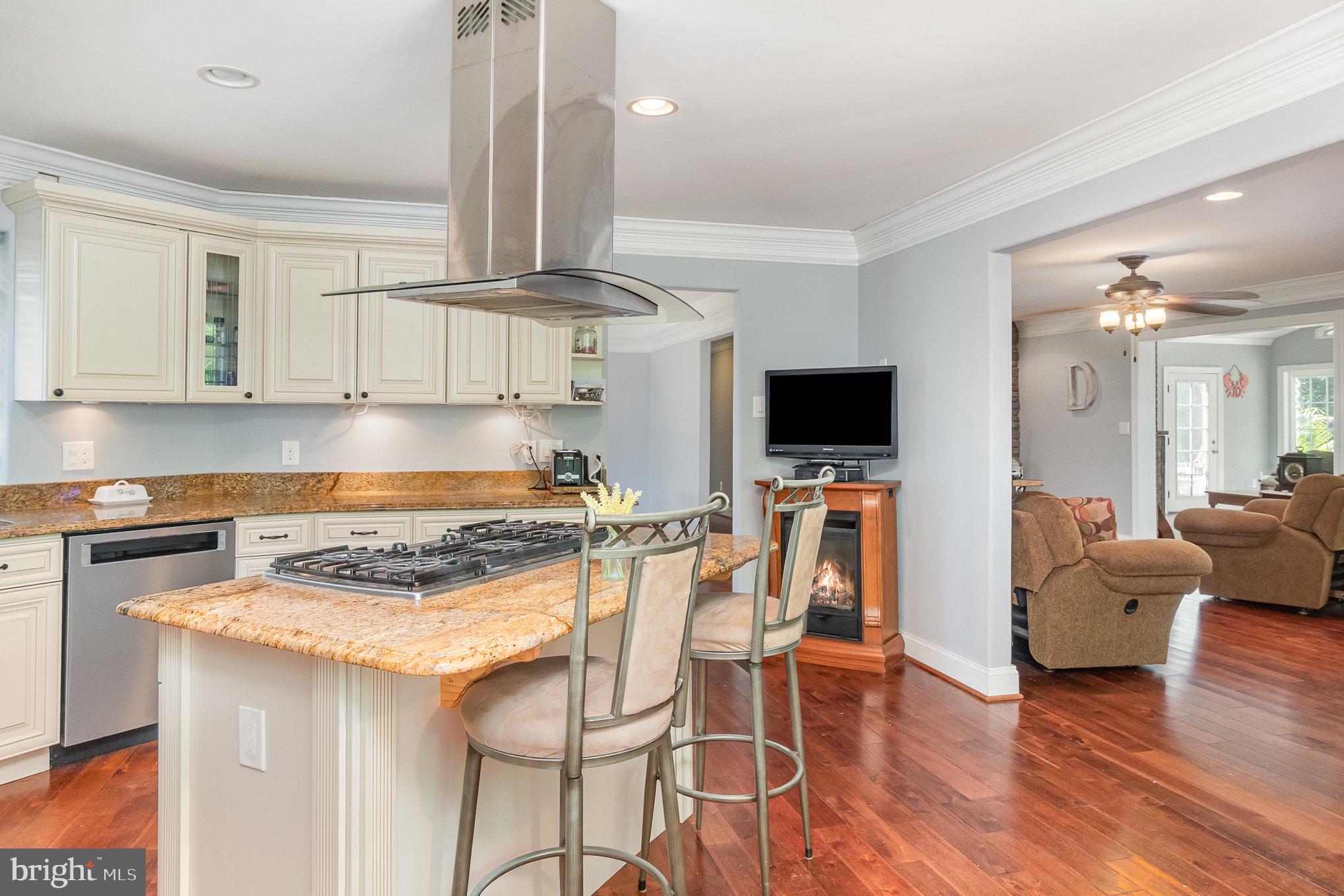 2414 Laurel Bush Road Abingdon, MD 21009 - Photo 26 of 68 a kitchen with stainless steel appliances granite countertop a stove top oven a sink dishwasher and a refrigerator with wooden floor