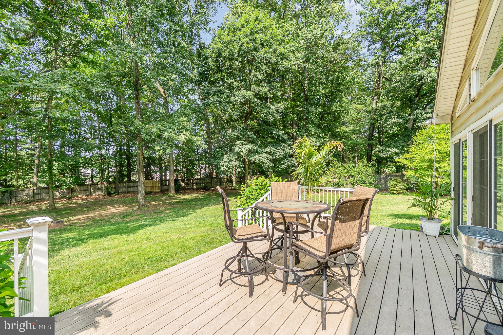 2414 Laurel Bush Road Abingdon, MD 21009 - Photo 43 of 68 a view of a backyard with table and chairs with wooden floor and fence