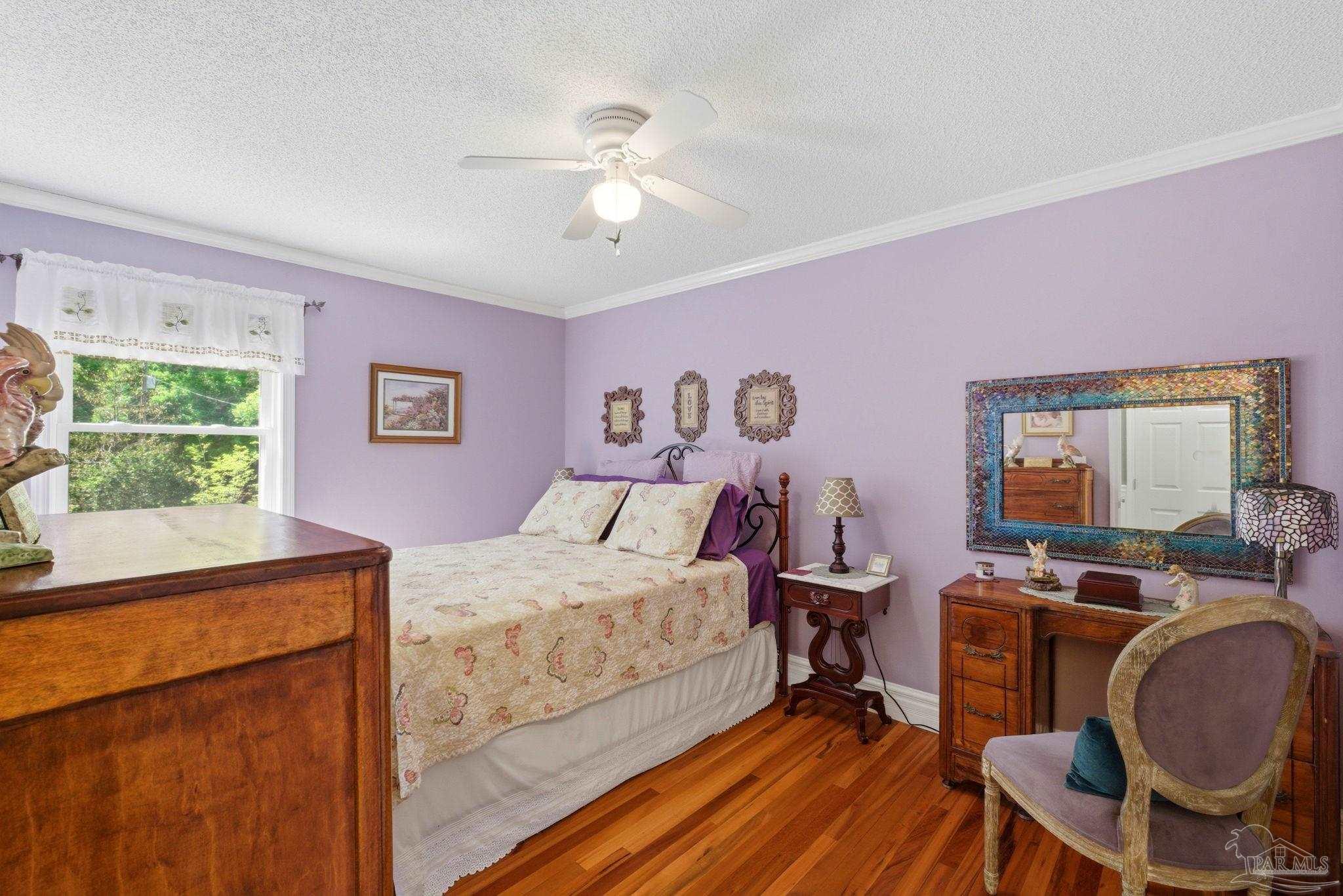 6930 Summit Way Milton, FL 32570 - Photo 38 of 71 a bedroom with furniture and a window