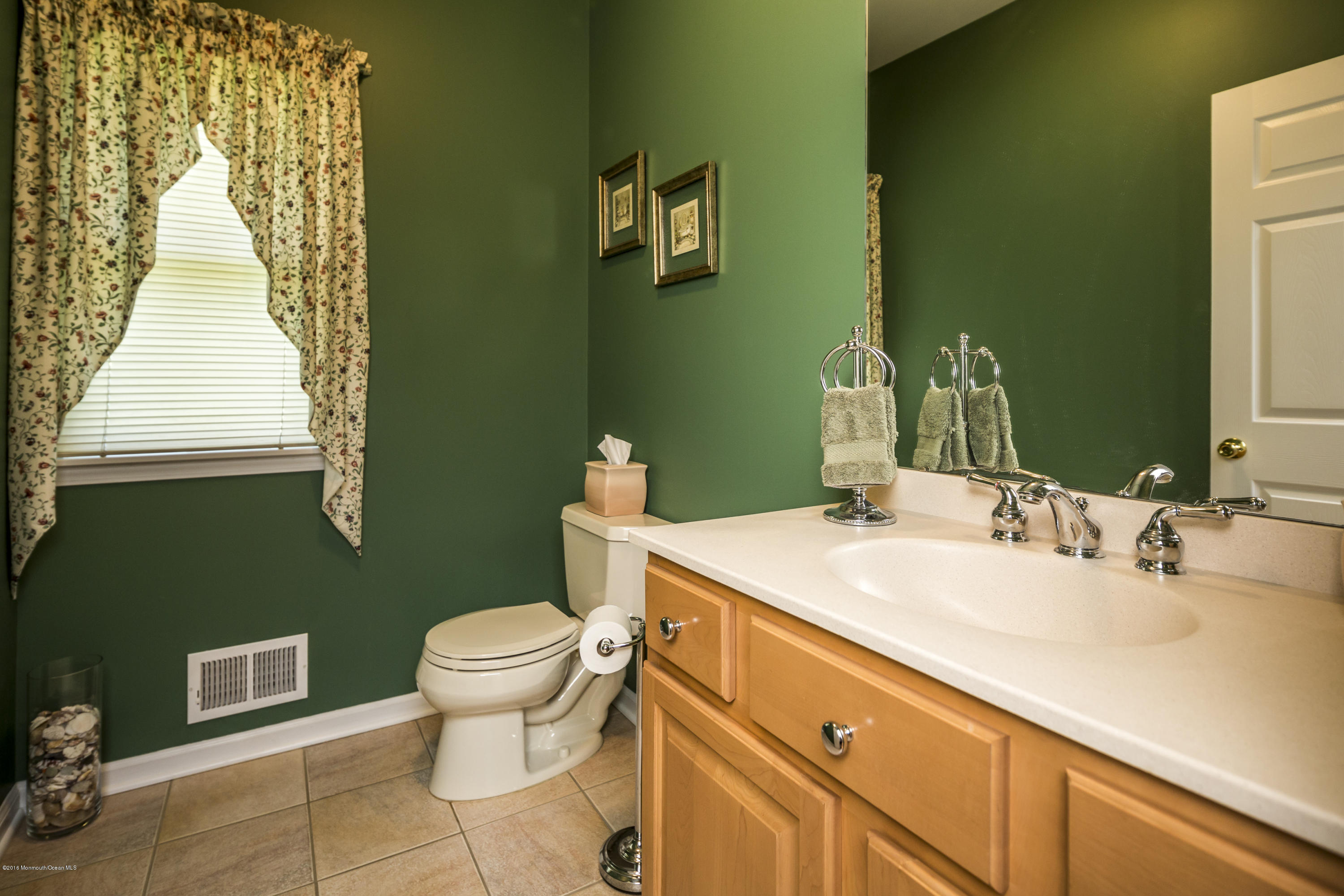 55 Spring Road Clarksburg, NJ 08510 - Photo 12 of 44 a bathroom with a sink and a mirror