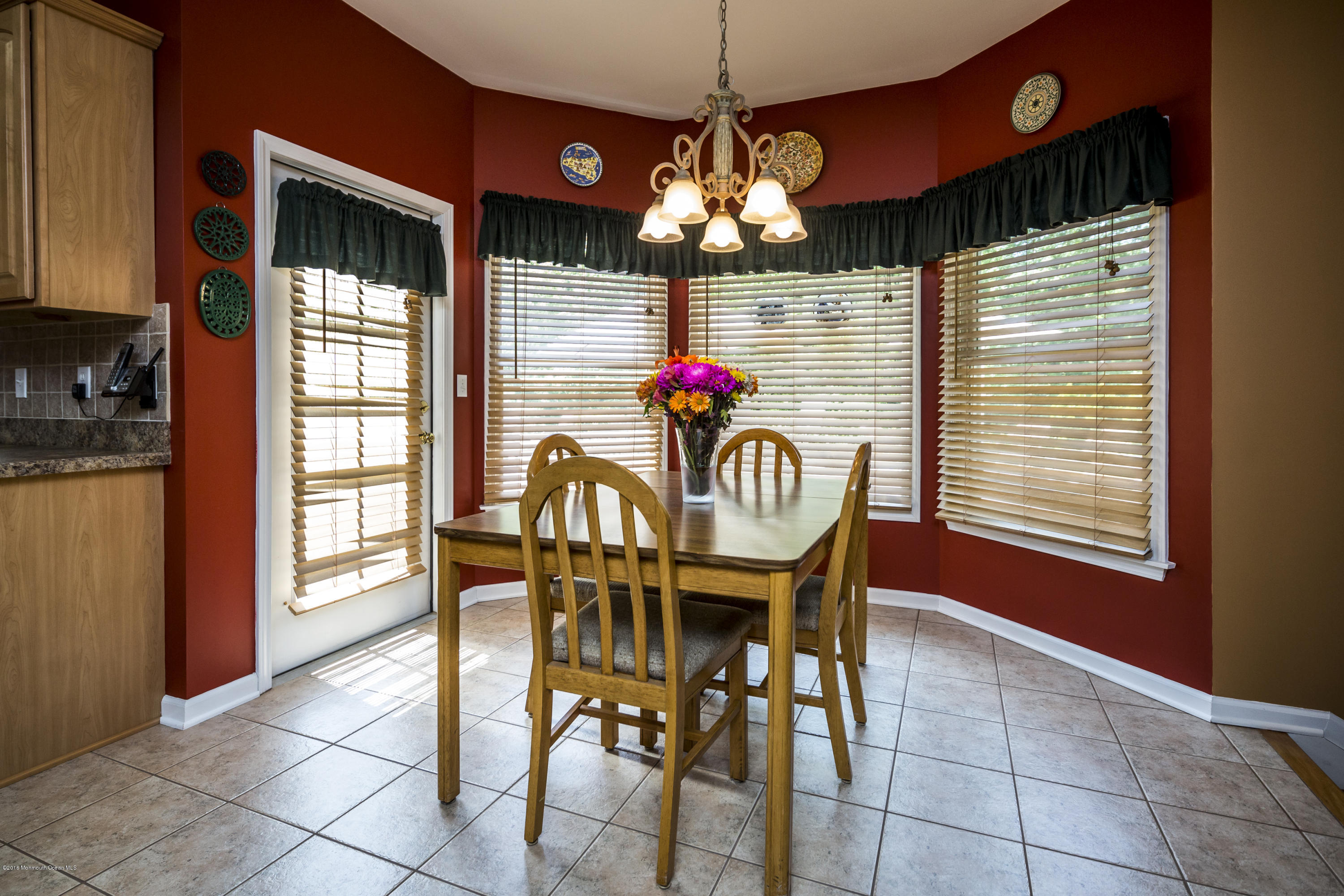 55 Spring Road Clarksburg, NJ 08510 - Photo 20 of 44 a view of a dining room with furniture and chandelier