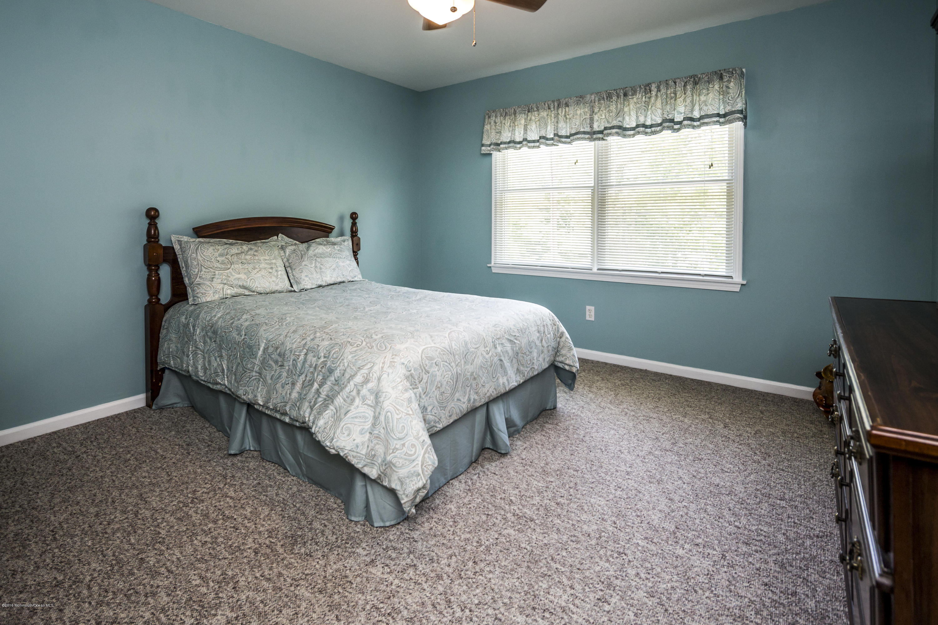 55 Spring Road Clarksburg, NJ 08510 - Photo 29 of 44 a bed sitting in a bedroom next to a window