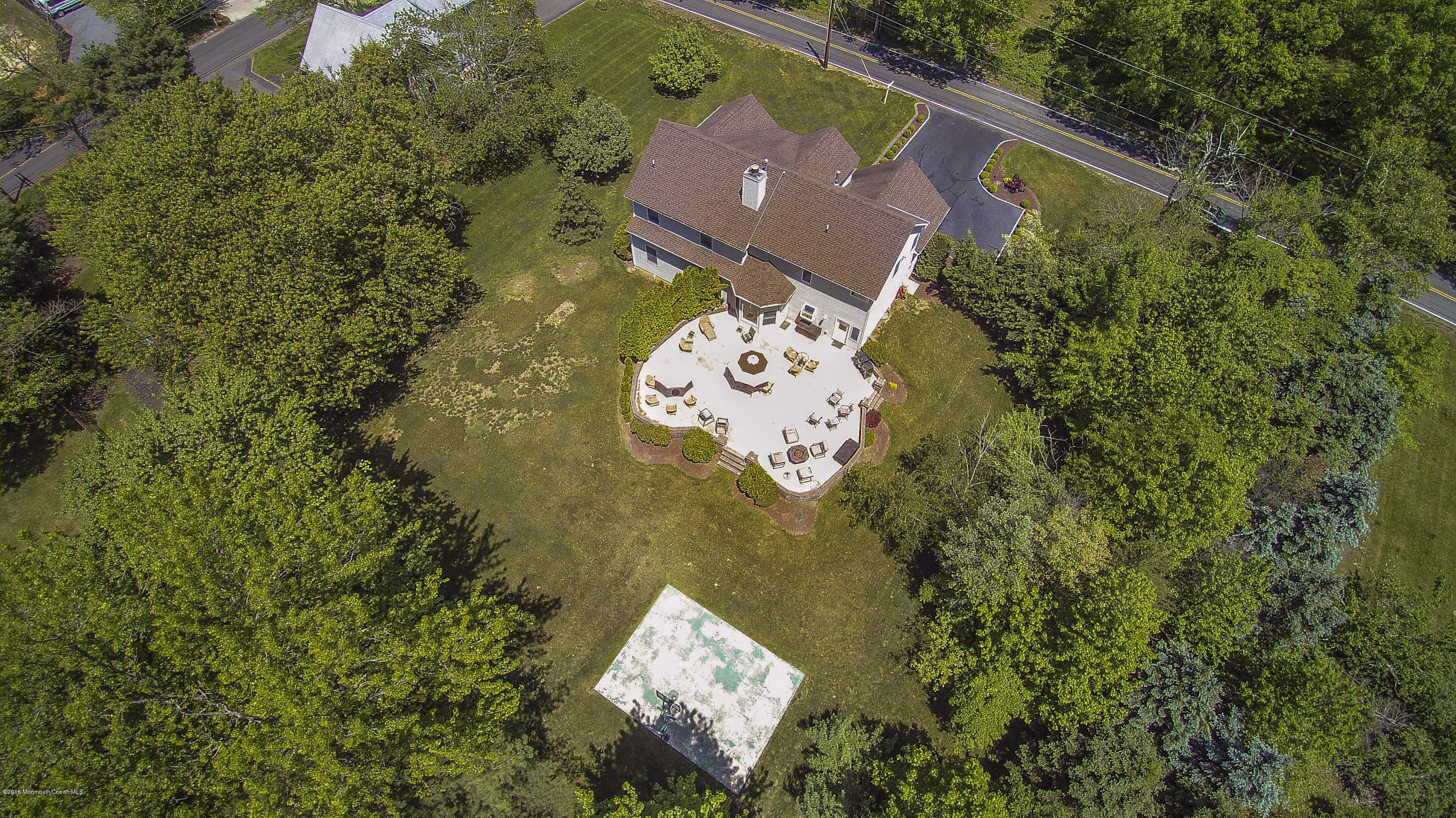 55 Spring Road Clarksburg, NJ 08510 - Photo 42 of 44 an aerial view of a house with garden space and a lake view