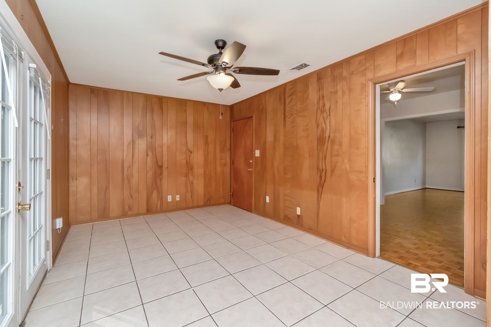 5517 Vanderbilt Drive Mobile, AL 36608 - Photo 13 of 33 Spare room with wooden walls, french doors, and ceiling fan