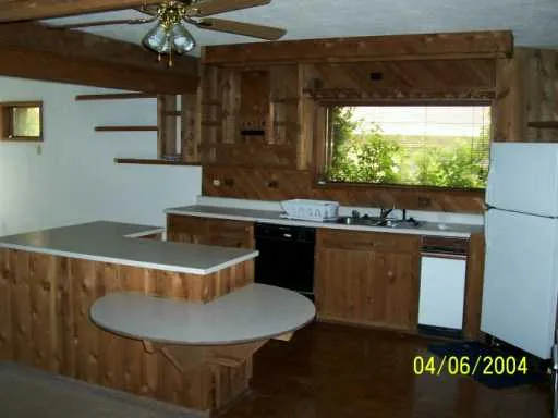 a kitchen with a sink and a stove