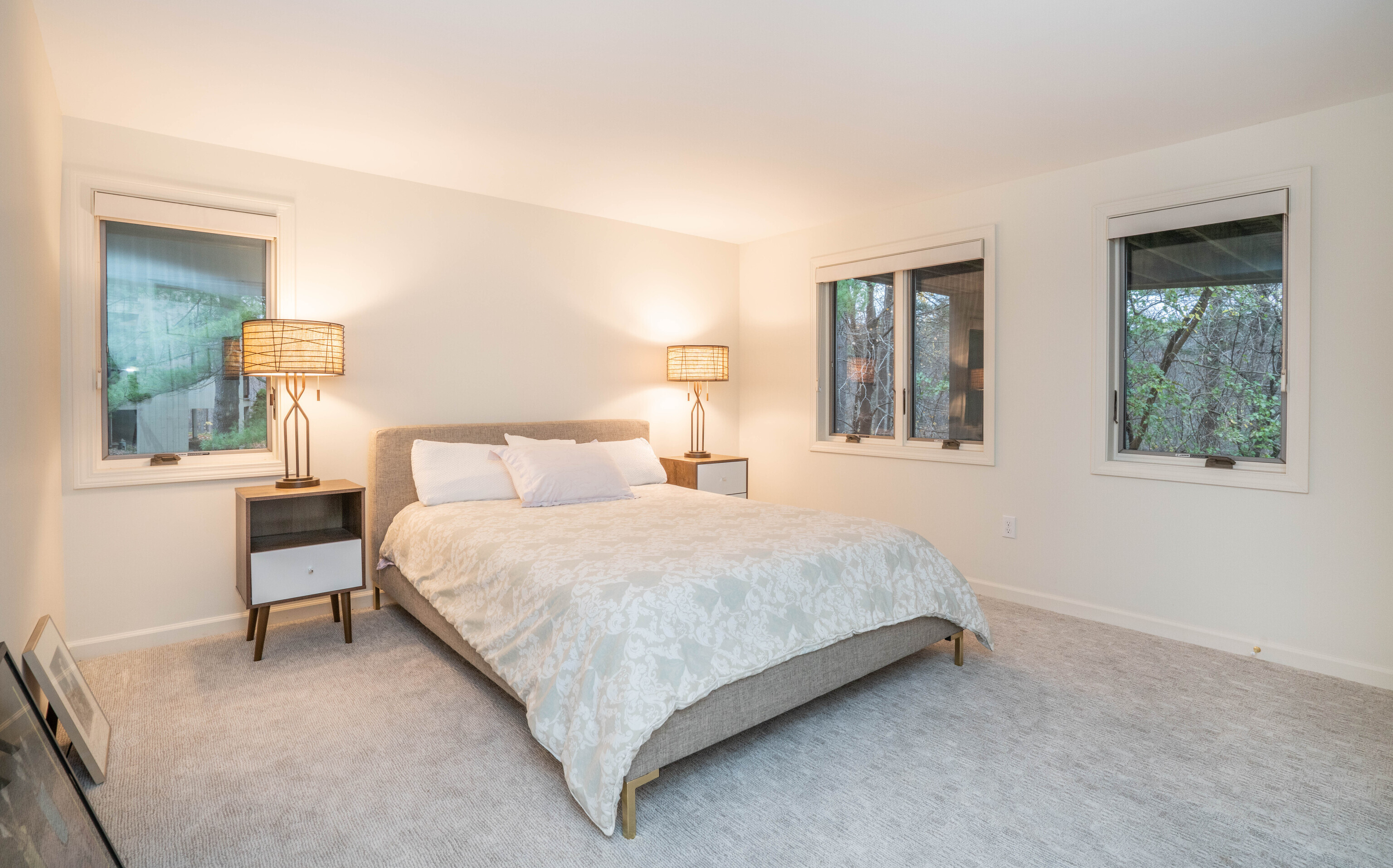 34 Cary Lane, Unit 34 Bloomfield, CT 06002 - Photo 15 of 40 a bedroom with a bed and a lamp on dresser