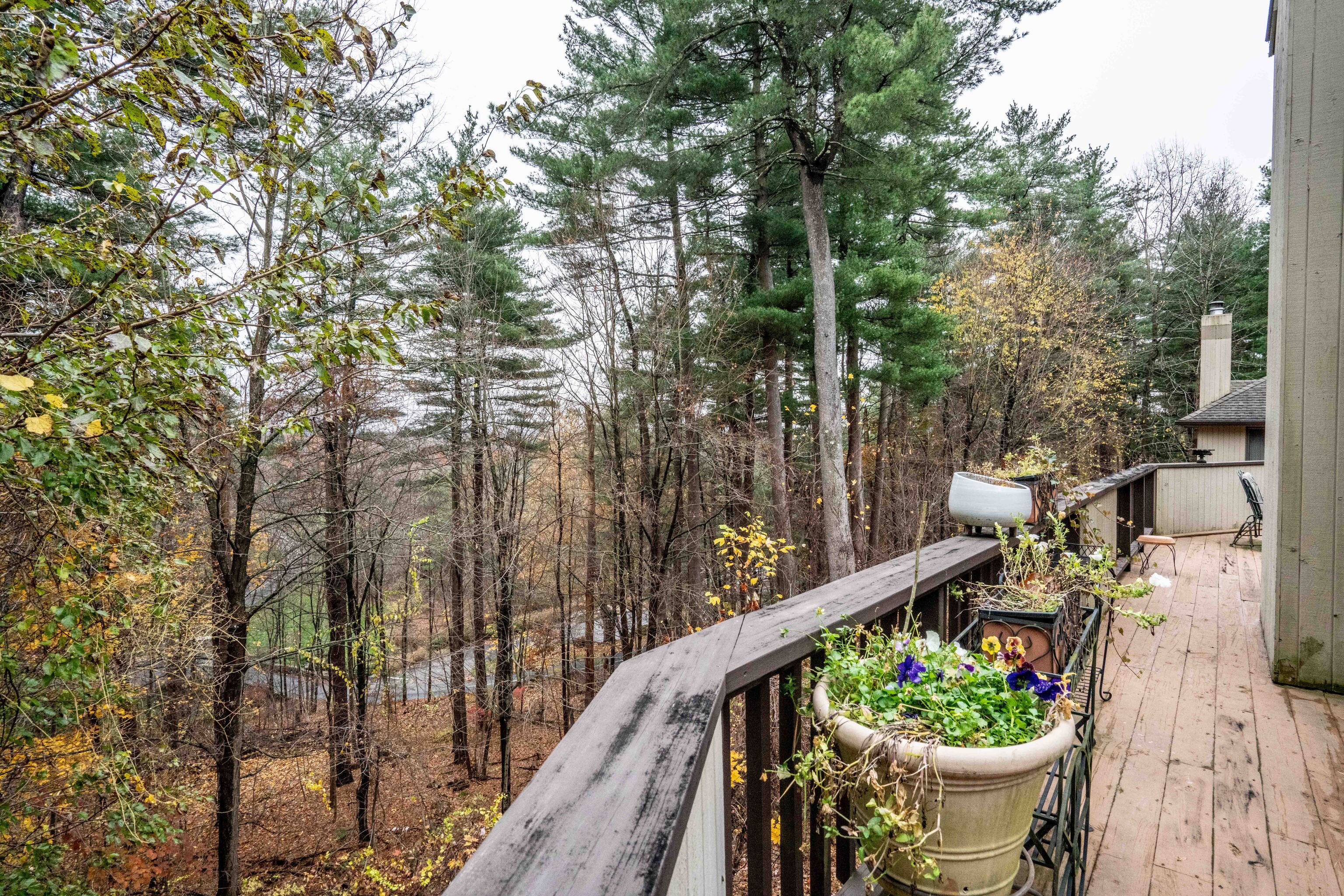 34 Cary Lane, Unit 34 Bloomfield, CT 06002 - Photo 28 of 40 a balcony with couple of chairs and wooden fence