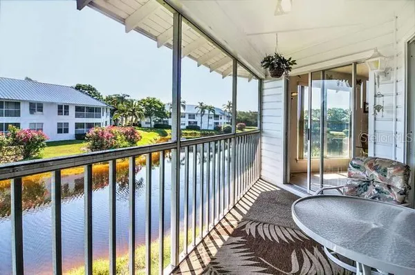 a view of a balcony and chairs