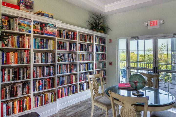 Undisclosed Address Bradenton, FL 34209 - Photo 26 of 27 a workspace with a book shelf and a book shelf