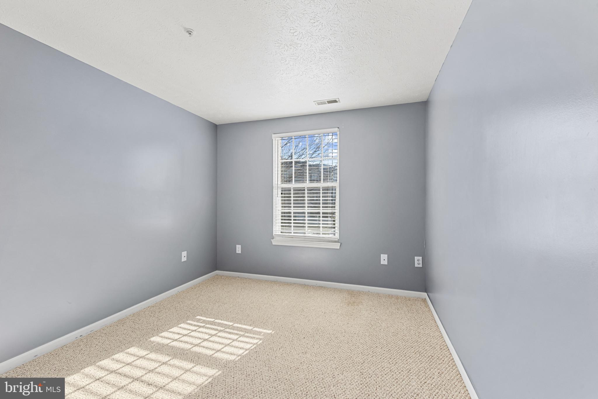 4122 Maple Path Circle, Unit 55 Nottingham, MD 21236 - Photo 20 of 27 Bright and airy room with soft gray walls.