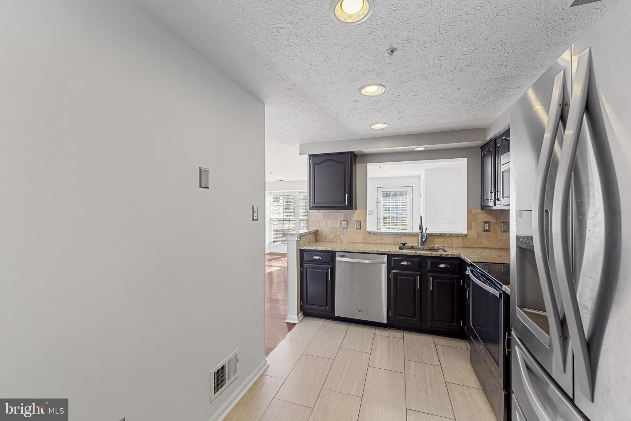 4122 Maple Path Circle, Unit 55 Nottingham, MD 21236 - Photo 6 of 27 Modern kitchen with sleek finishes.