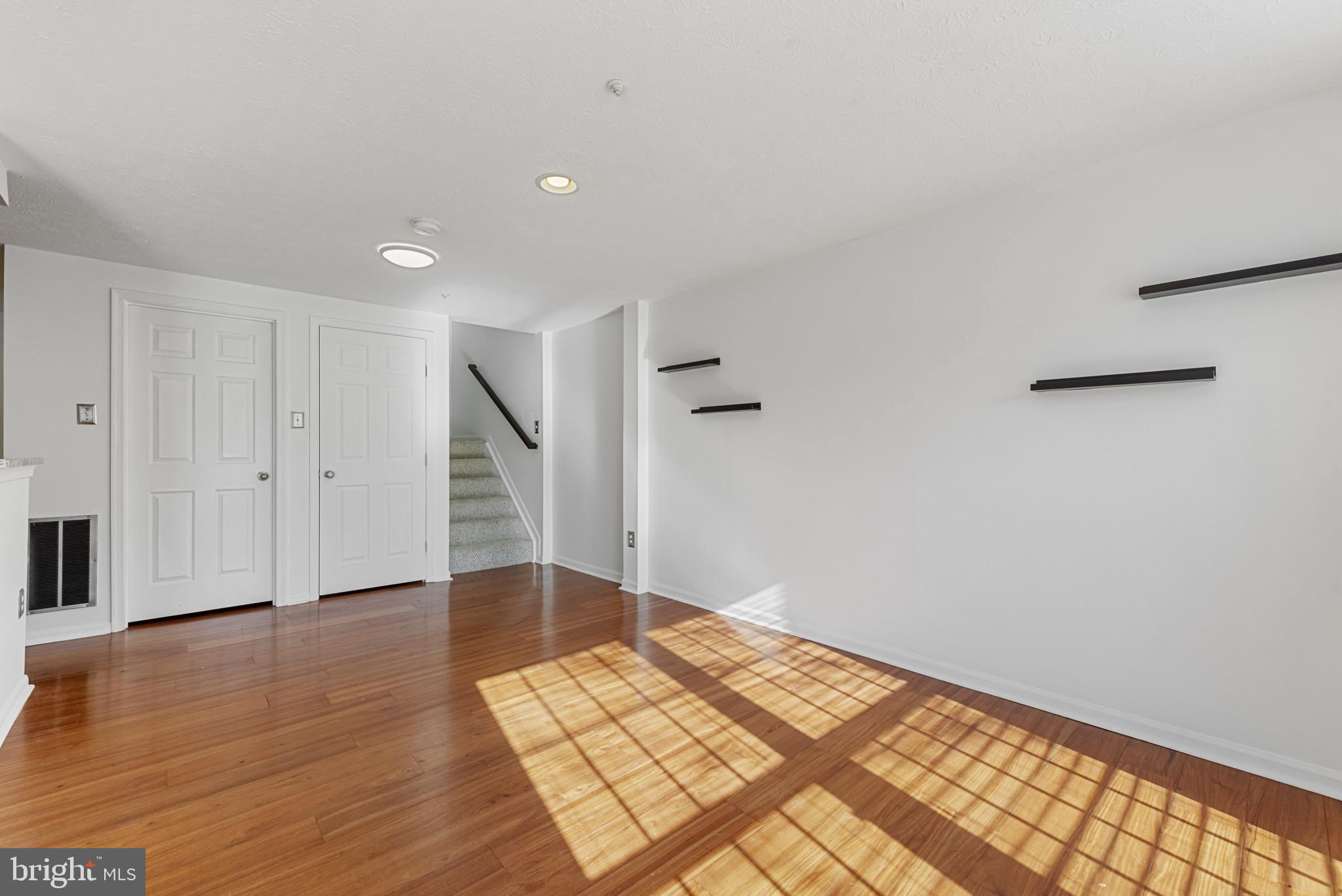 4122 Maple Path Circle, Unit 55 Nottingham, MD 21236 - Photo 9 of 27 Bright and airy space with warm wood floors.