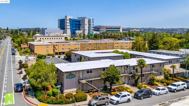 a aerial view of a house with a swimming pool and outdoor seating