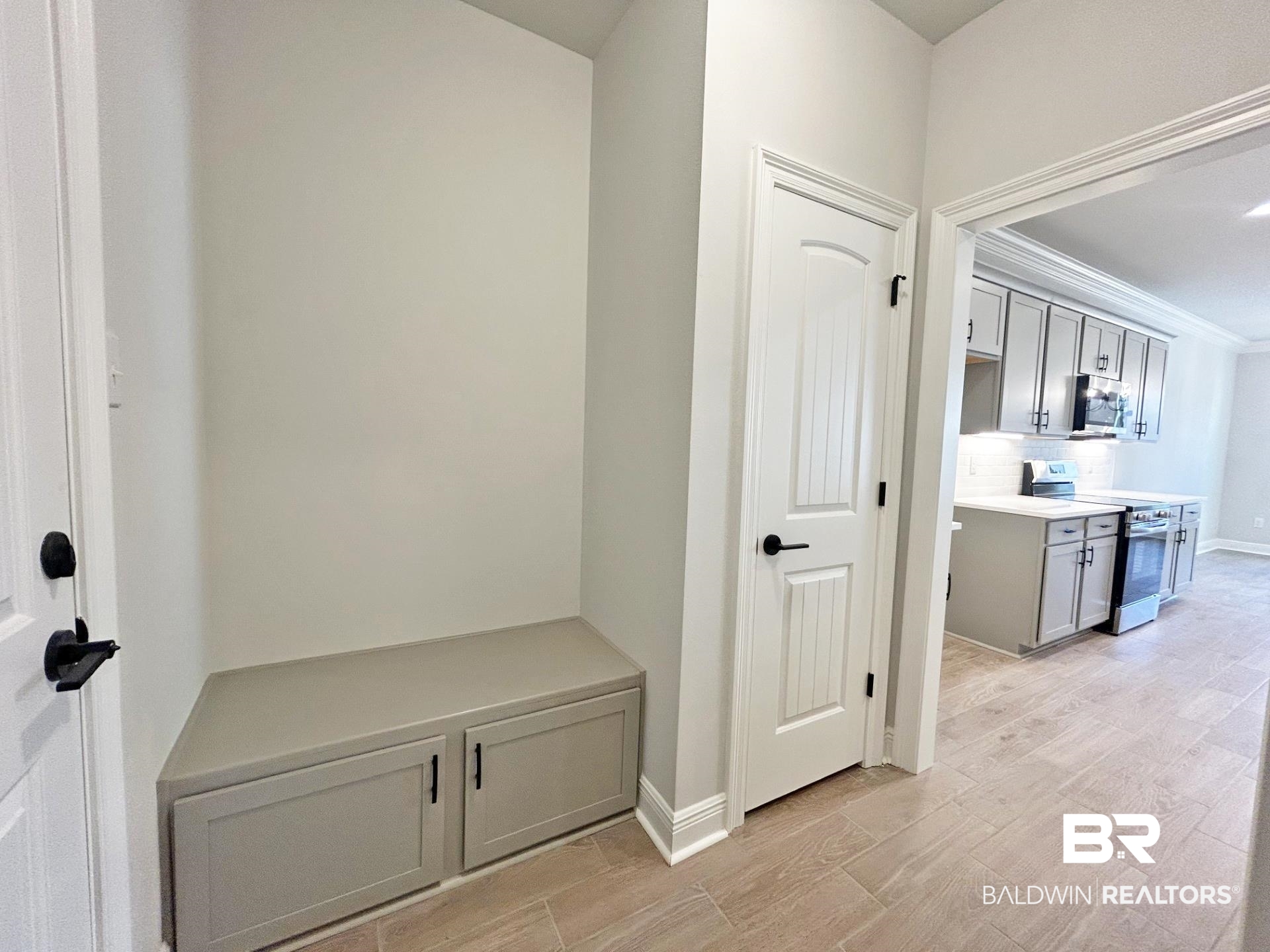 825 Sumter Loop Foley, AL 36535 - Photo 16 of 21 Mudroom featuring wood finish floors and ornamental molding