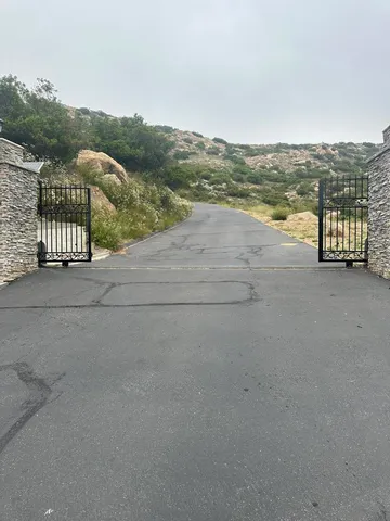 a view of a field with a mountain in the background