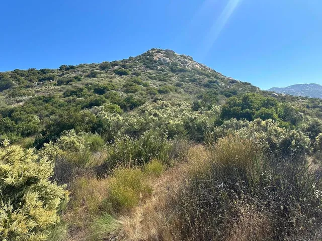 a view of a lake with mountains in the background