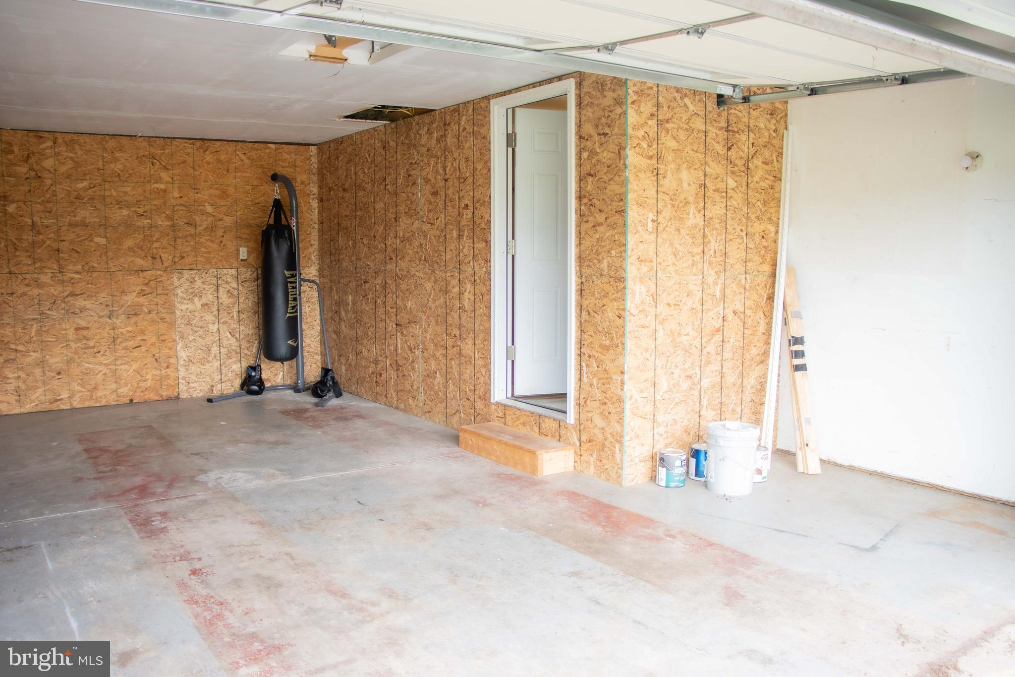 369 West Ridge Loop Road Romney, WV 26757 - Photo 35 of 43 Garage with entry to Half bath off Main Bedroom