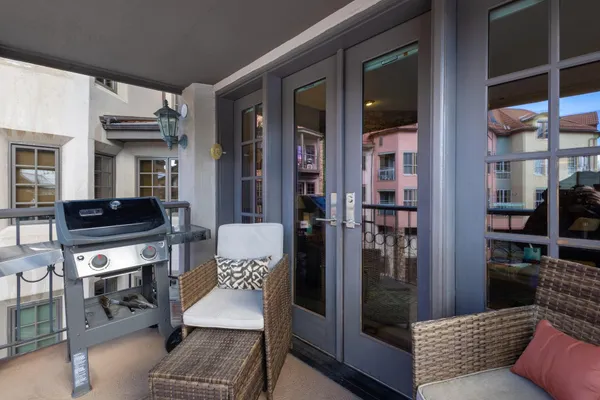 a outdoor space with balcony and furniture