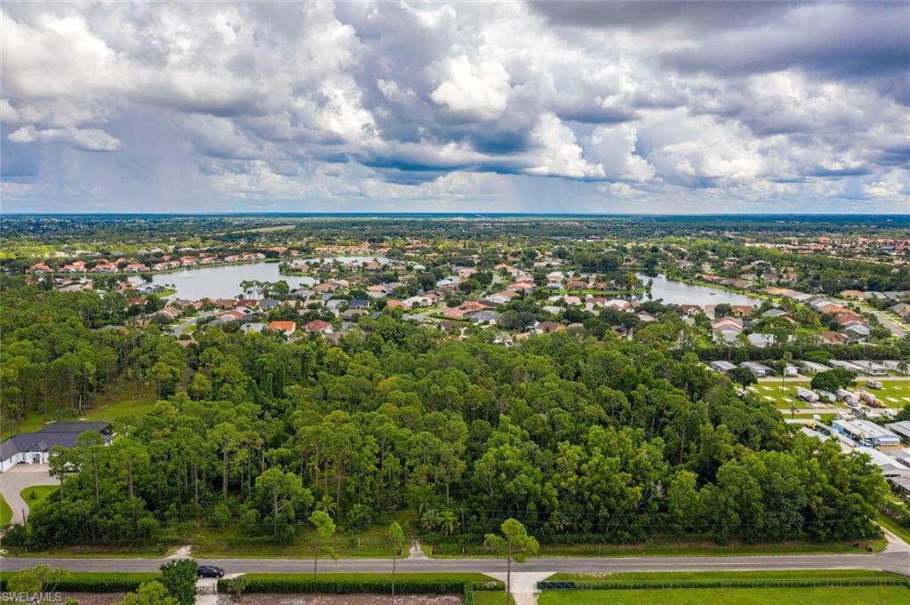 771 St Clair Shores Road Naples, FL 34104 - Photo 2 of 3 a view of a yard with an outdoor seating